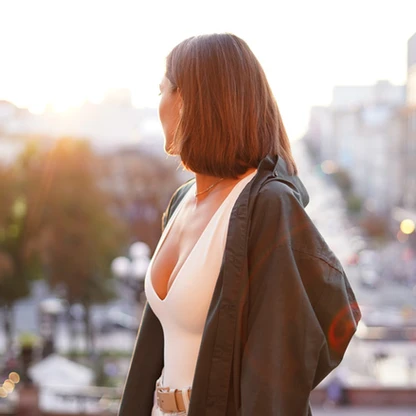 woman-sunset-with-amazing-city-view-enjoying-warm-days-freedom-positive-vibes.jpg